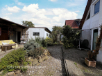 Zwei Wohnungen unter einem Dach – Feldrandlage mit Garten, Garagen & Naturblick - ELW Terrasse